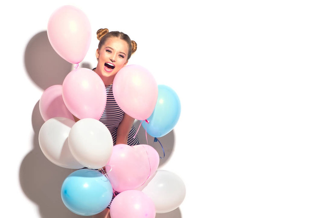 joyful teenage girl with colorful air balloons having fun over white background - Valokuva, kuva