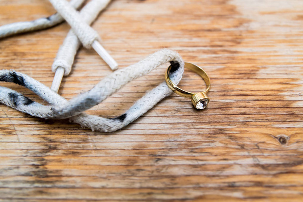 Diamond ring on a shoelace - Foto, imagen