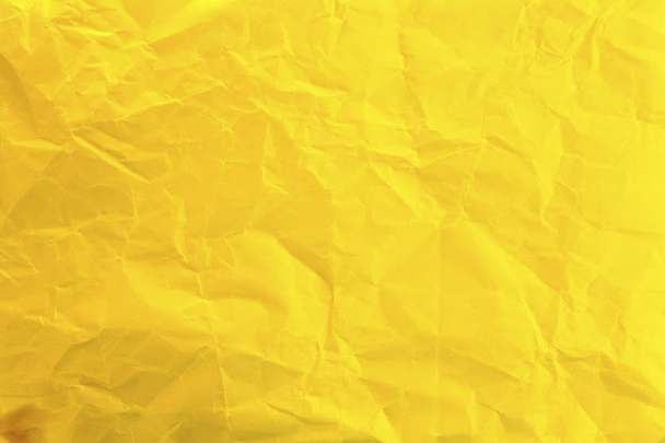 Crumpled yellow paper as background - Фото, зображення