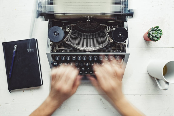 Writer typing with retro writing machine. - Photo, Image