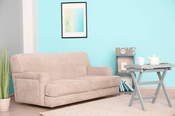 Stylish sofa in interior of living room - Zdjęcie, obraz
