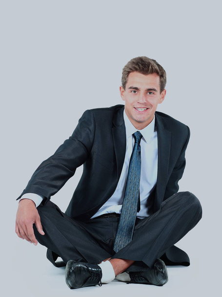 business man sitting isolated on a white background. - Foto, imagen
