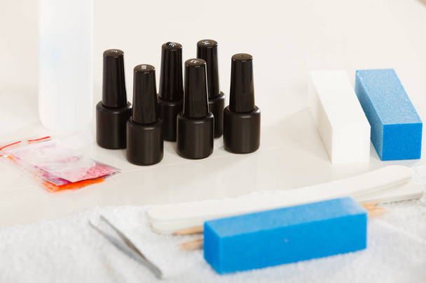 Professional gel hybrid manicure set at beautician salon - Φωτογραφία, εικόνα