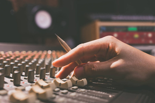 male sound engineer hands working on sound mixer for recording, broadcasting, music production background - Φωτογραφία, εικόνα