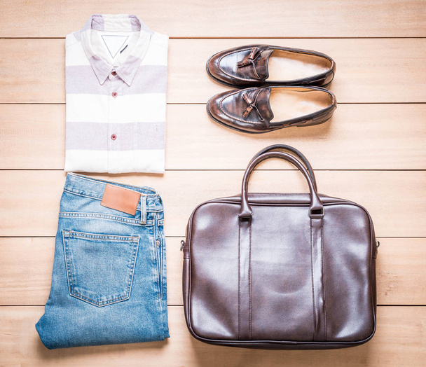 Clothing for men on the wooden background - 写真・画像
