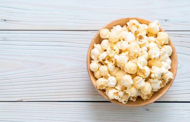 sweet popcorn on wood - 写真・画像