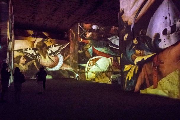 Les Baux, France - June 26, 2017: The Fantastic and Wonderful World of Bosch, Brueghel and Arcimboldo. The show lasts about thirty minutes and contains over 2,000 digital images displayed on an area of 7,000 m2 in the Carrires de Lumires  - Fotó, kép