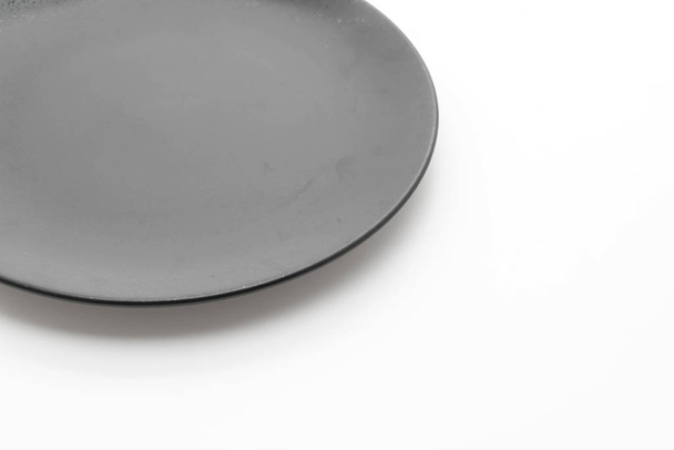 black plate on white background - Φωτογραφία, εικόνα