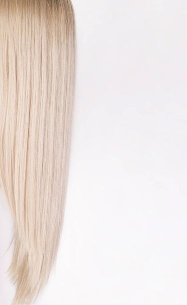 Pattern of a cold blonde hair over white background. - Φωτογραφία, εικόνα