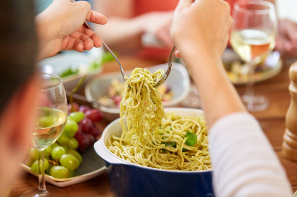 pasta with basil in bowl and other food on table - Foto, immagini