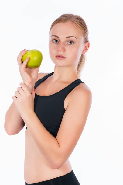 Girl with a green apple in her hand - Foto, afbeelding