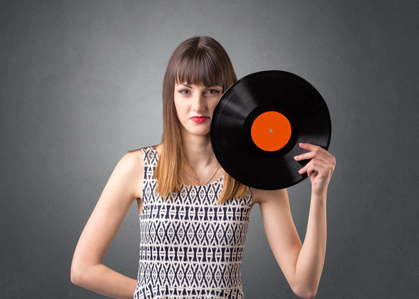 Lady holding vinyl record - Foto, Bild