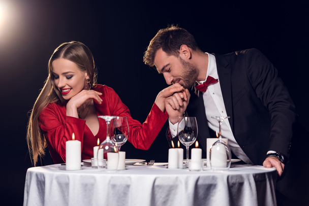 happy beautiful couple spending time on romantic date in restaurant - Photo, Image