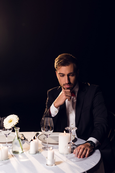 handsome bearded man in jacket waiting for romantic date in restaurant  - Photo, Image