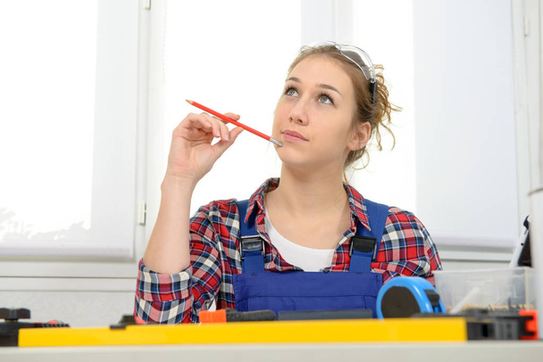 portrait of young woman apprentice carpenter - Photo, Image