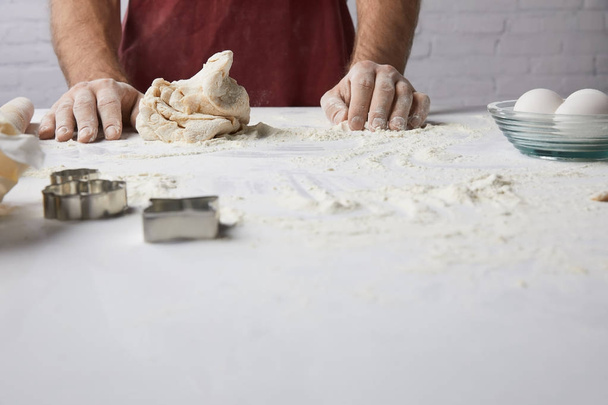 cropped image of chef standing at table with dough - 写真・画像