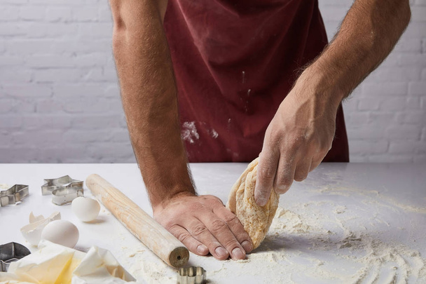 cropped image of chef preparing dough in kitchen - 写真・画像