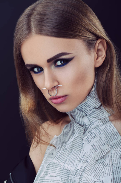 Closeup beauty portrait of young beautiful woman blond girl with long straight hair with natural makeup, piercing in nose. Hairstyle and skincare and cosmetics concept - Photo, Image