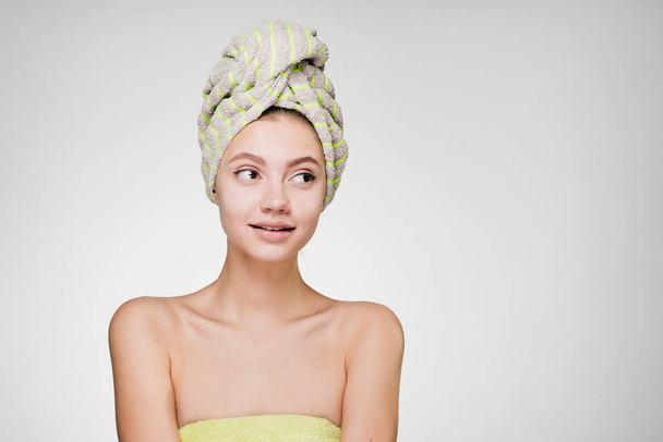 cute beautiful girl with a towel on her head thinking about beauty, day spa - Fotografie, Obrázek