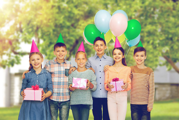 happy children with gifts at birthday party - Фото, зображення