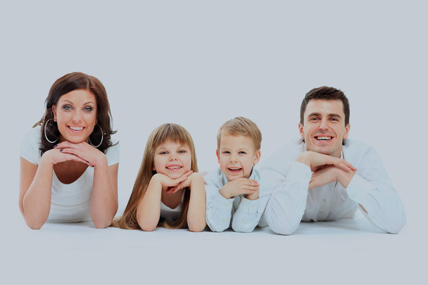 Beautiful happy family - isolated over a white background. - Zdjęcie, obraz