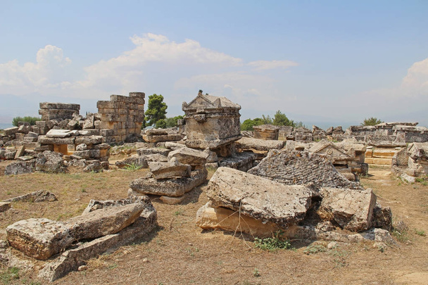 The ruins of the ancient Hierapolis city next to the travertine pools of Pamukkale, Turkey. - Zdjęcie, obraz