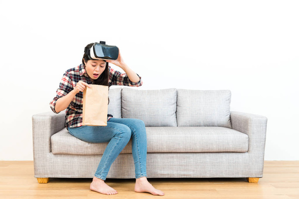 young woman experiencing 3D game getting dizziness - Foto, afbeelding