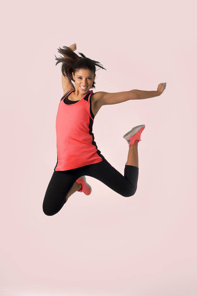 young happy and beautiful girl jumping crazy excited in female s - Foto, imagen