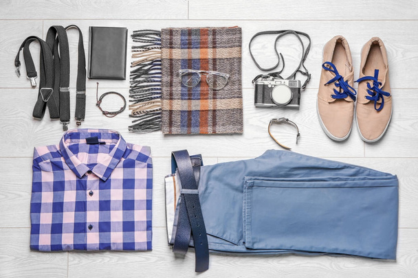 Set of hipster clothes on wooden floor, flat lay - Foto, Imagen