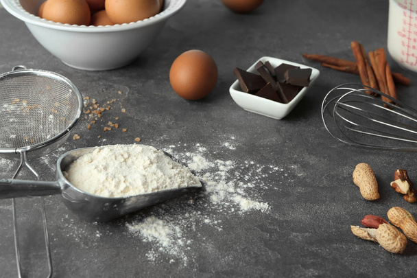 Ingredients and utensils for cooking pastries on grey background - Zdjęcie, obraz