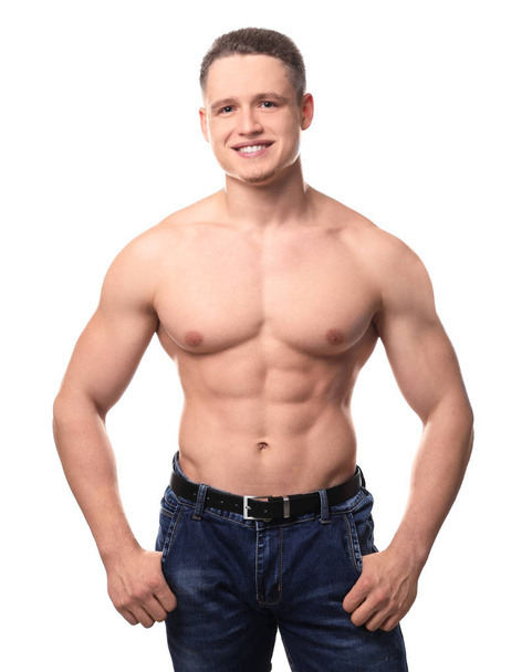 Muscular young bodybuilder on white background - Fotó, kép