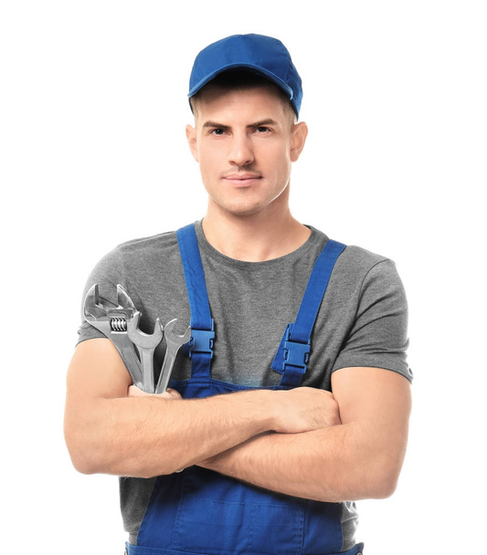 Handsome auto mechanic with tools on white background - Zdjęcie, obraz