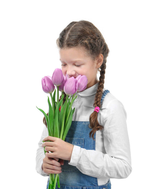 Cute little girl with tulip bouquet for Mother's day on white background - Foto, imagen