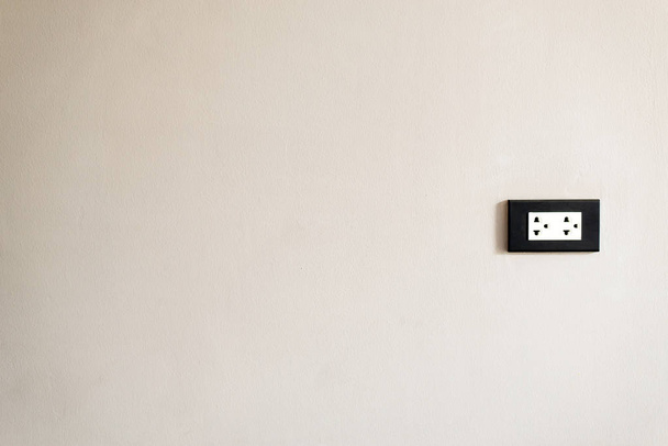 Electronic house plug on white wall  - Foto, Bild