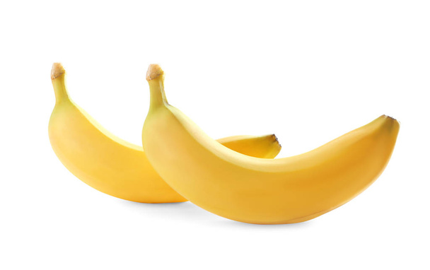 Ripe bananas on white background - Фото, изображение