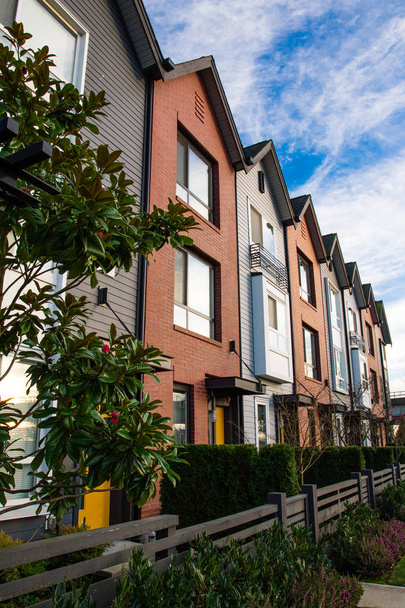 A row of new real estate townhouses or condominiums. - Photo, Image