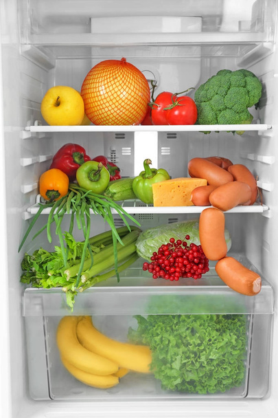 Refrigerator with fresh products, closeup - Fotoğraf, Görsel