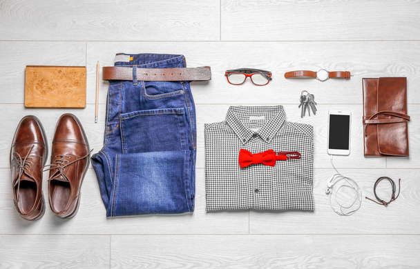 Set of hipster clothes on wooden floor, flat lay - Photo, Image