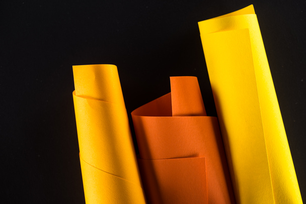 rolled color papers isolated on black - Photo, Image