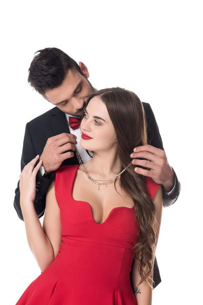 boyfriend wearing necklace on girlfriend isolated on white - Photo, image