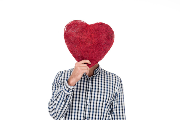 man covering face with heart of threads isolated on white, valentines day concept - Fotoğraf, Görsel