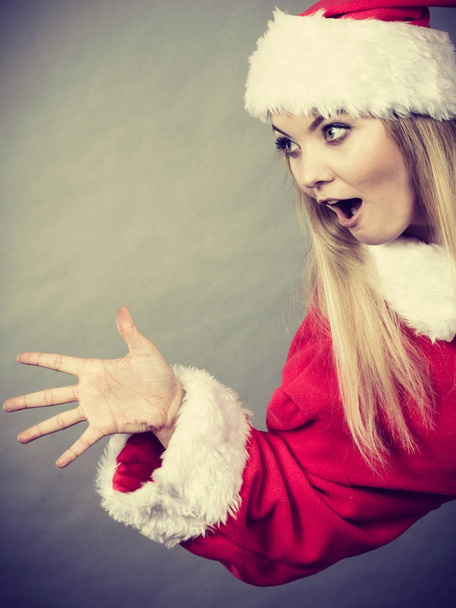 Happy woman wearing Santa Claus helper costume - Фото, изображение