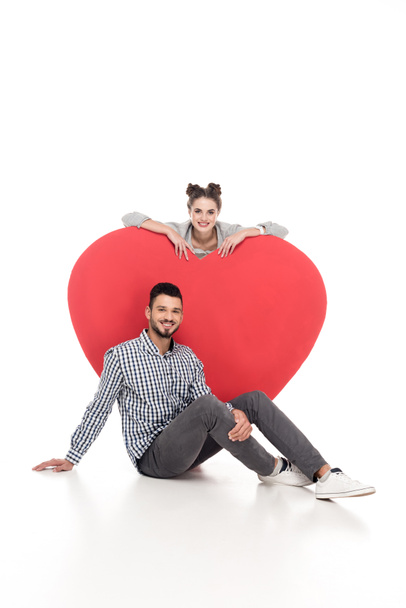 happy couple near big heart on white, valentines day concept - Фото, зображення