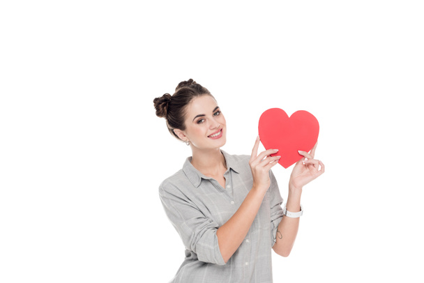 smiling girl holding red paper heart isolated on white, valentines day concept - Fotó, kép