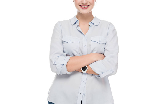 cropped image of smiling girl with crossed arms isolated on white - Φωτογραφία, εικόνα