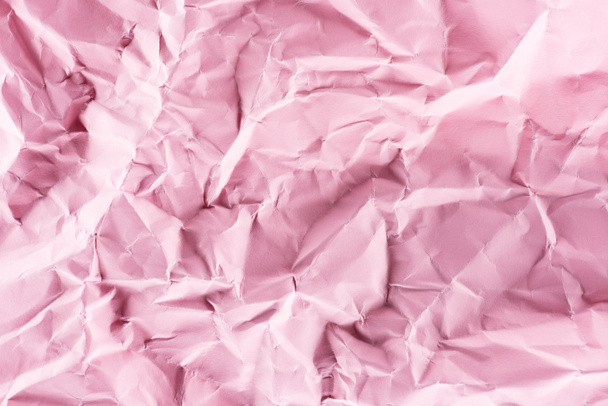 close-up shot of crumpled pink paper for background - Photo, Image