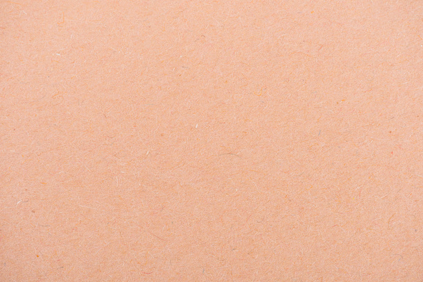 texture of peach-orange color paper as background - Foto, Imagen