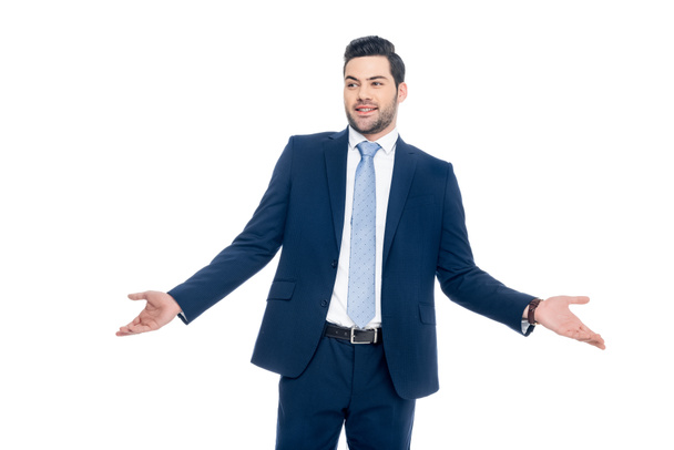 smiling businessman with shrug gesture, isolated on white - Photo, Image