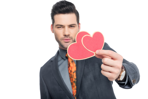 handsome man with valentines greeting card, isolated on white - Fotó, kép