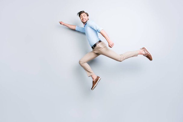 Happy, attractive, handsome, young man with bristle jumping in a - Fotografie, Obrázek